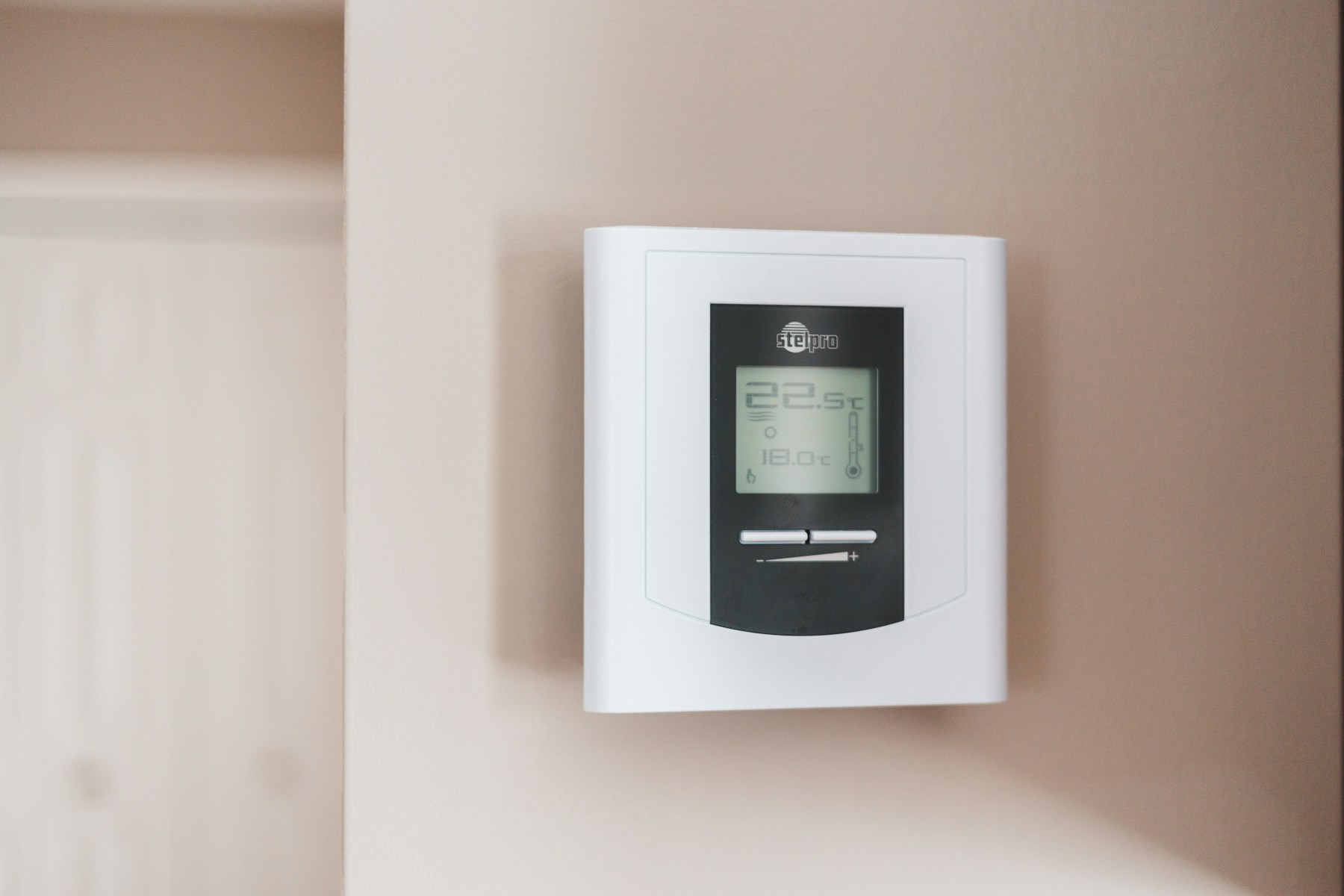 Thermostat showing room and target temperatures